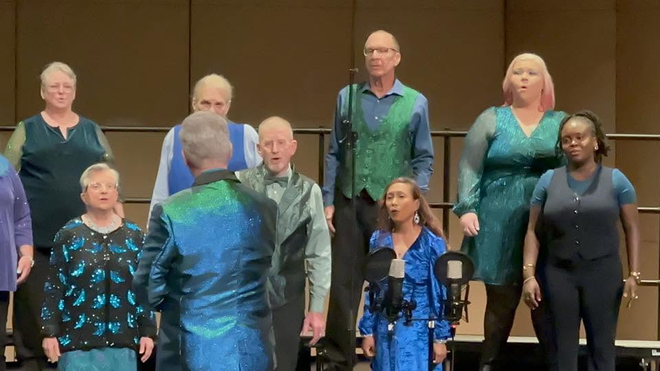 Voices of the Sound members singing together