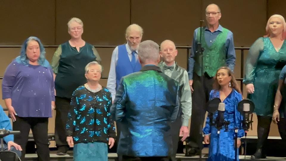 Voices of the Sound members singing together